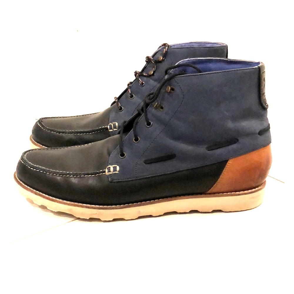 Men's black, blue and brown leather boots.